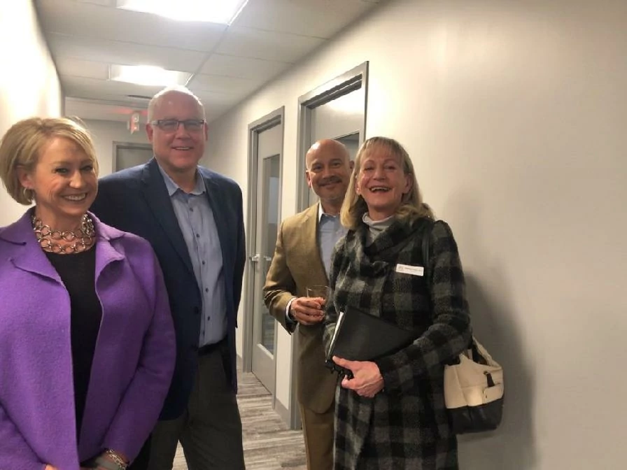 Carrie and Dan enjoying conversation with guests at our Open House