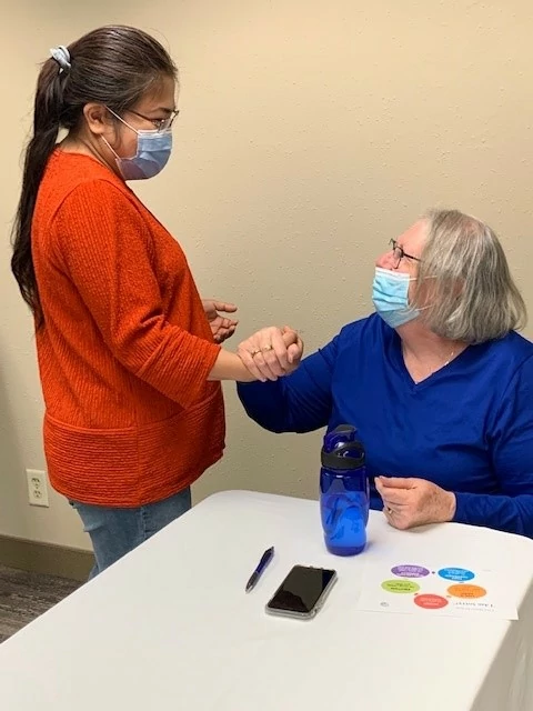 Caregivers practicing hand over hand