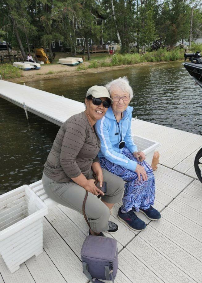 Here is a photo of Carol and their home nurse, Tilly, enjoying one of the greatest weekends up at the lake!