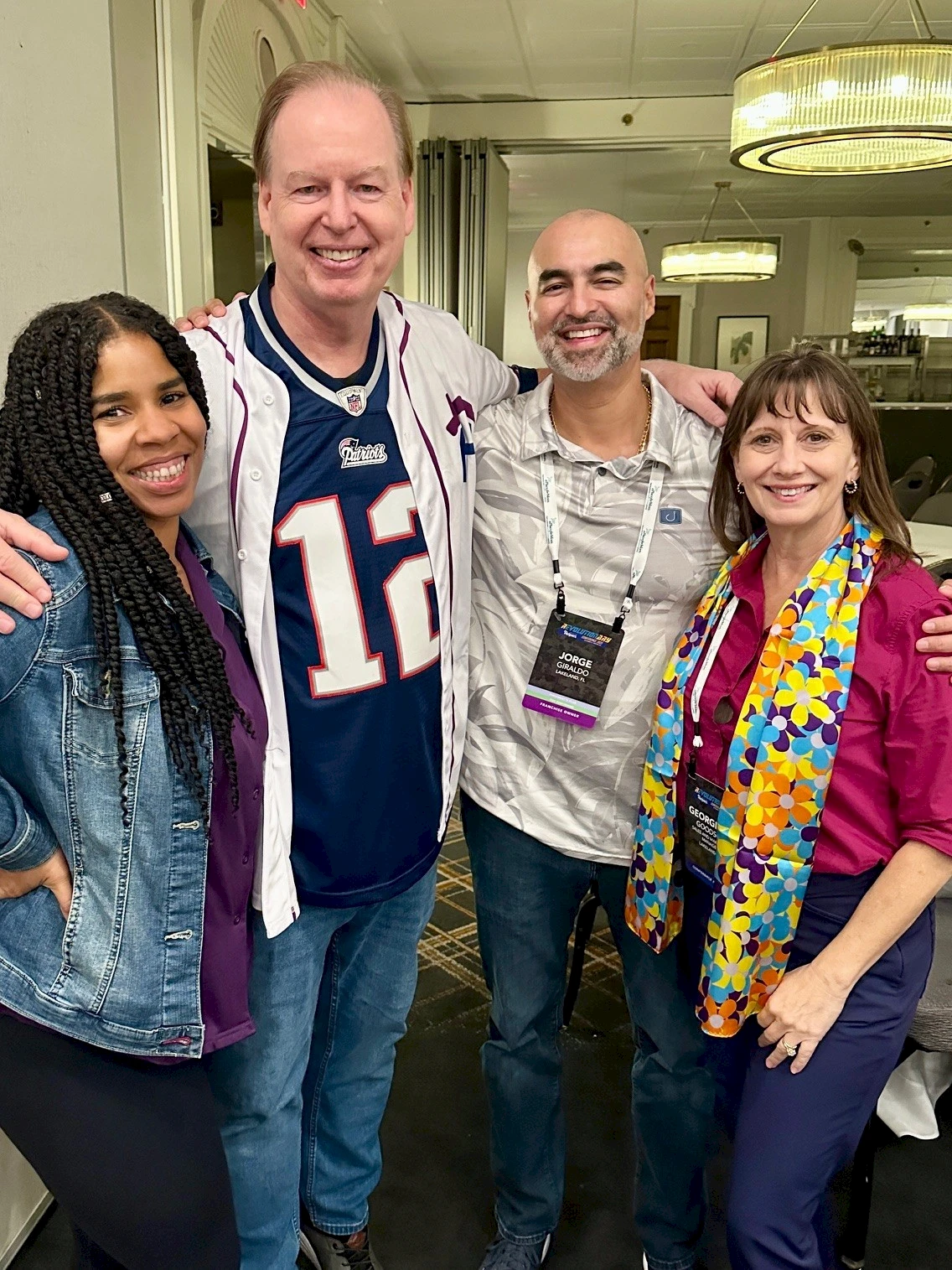Senior Helpers Conference 2025 in Boston - Photo op with Peter Ross, CEO & Co-Founder of Senior Helpers. Artie Jones, Peter Ross, Jorge Giraldo, and Georgiana Goodson.
